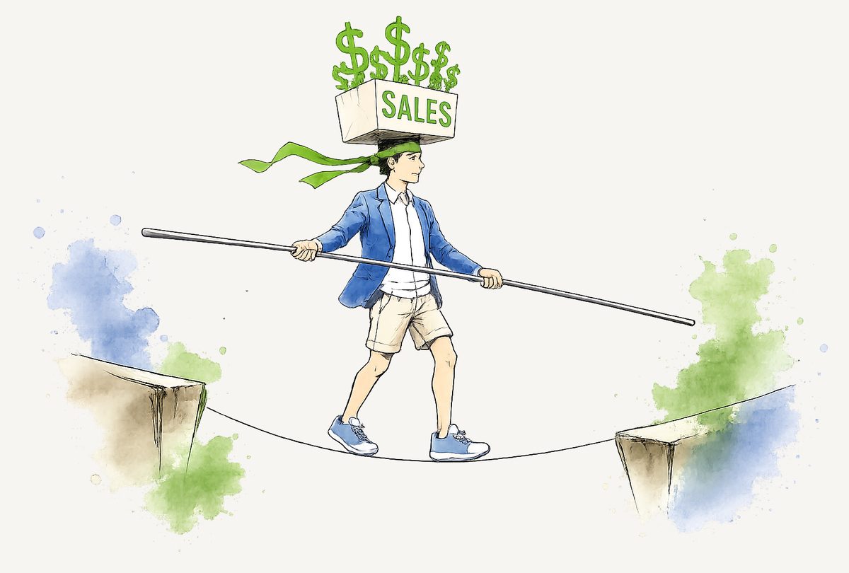 A salesperson balancing a box of revenue on their head while crossing a tightrope over the gap between two cliffs